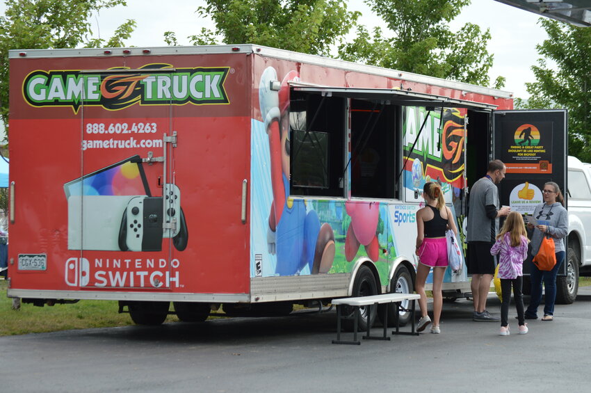 A video game truck was at the 2023 RexRun, inviting attendees to enter and play video games at the Arapahoe County Fairgrounds.